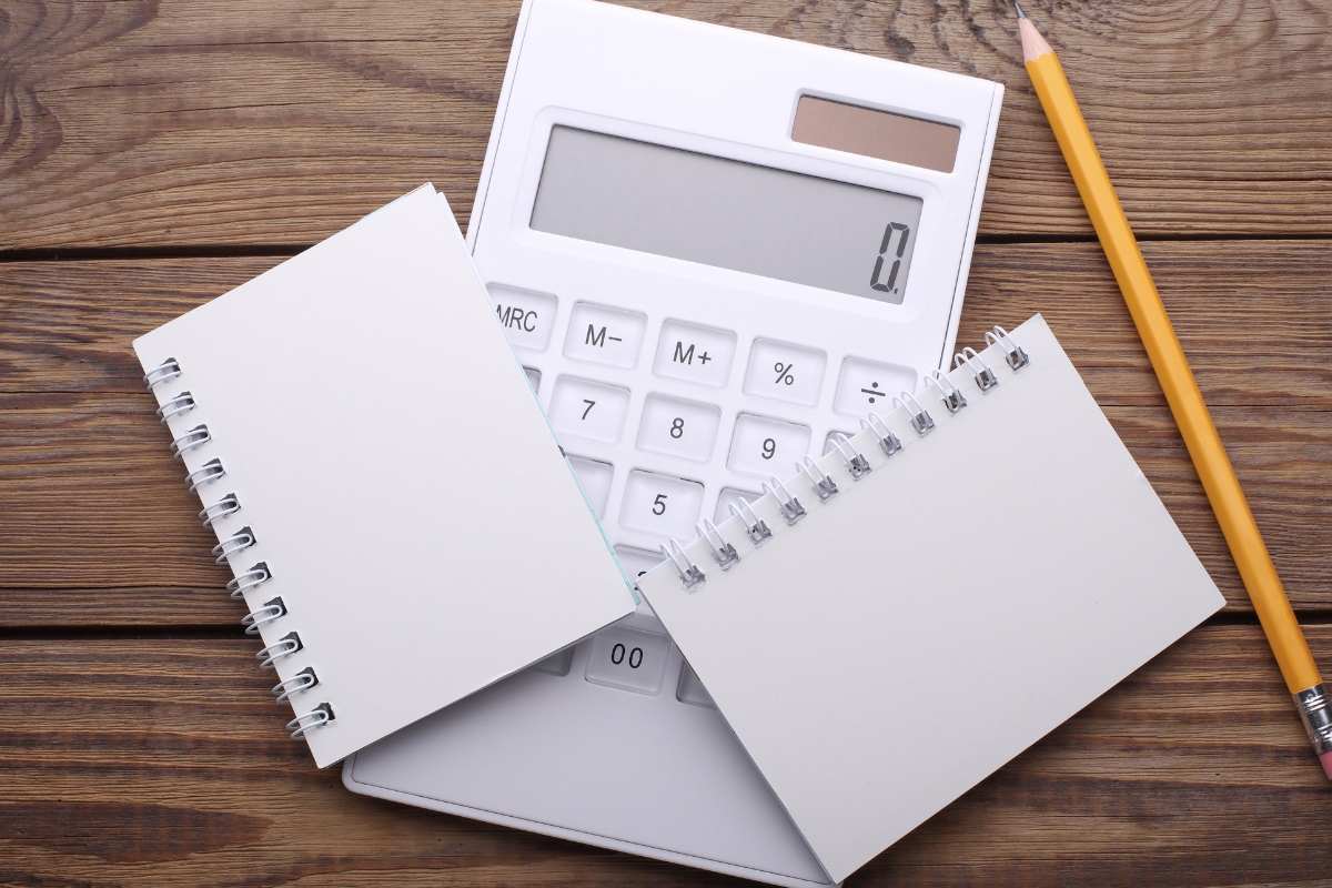 photo of disk with calculator, pencil, and notepad