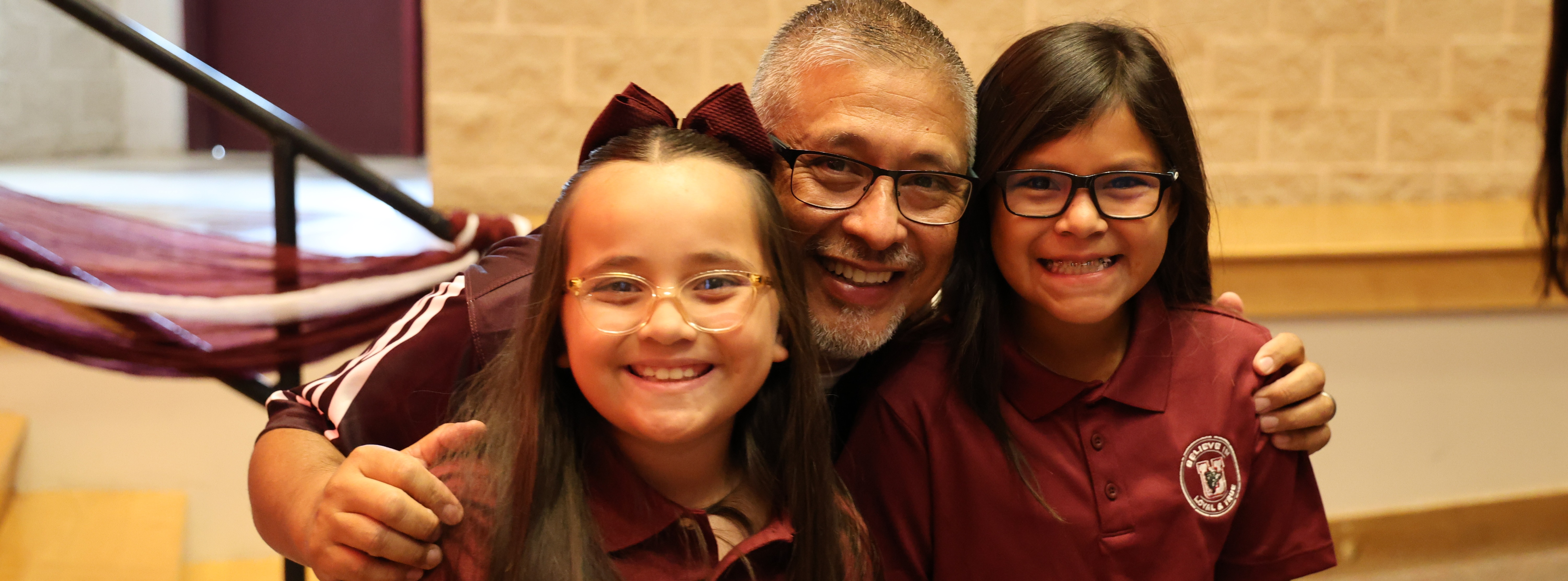 principal and kids smiling
