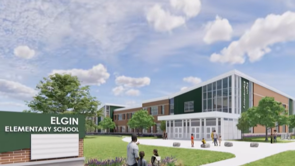 A rendering of a new school with an entrance sign. People walk on the sidewalk in front of the building.