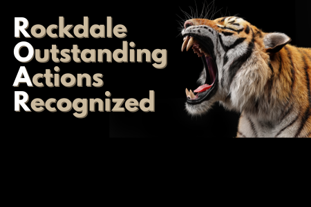 Tiger roaring on Black Background with text saying "Rockdale Outstanding Actions Recognized"