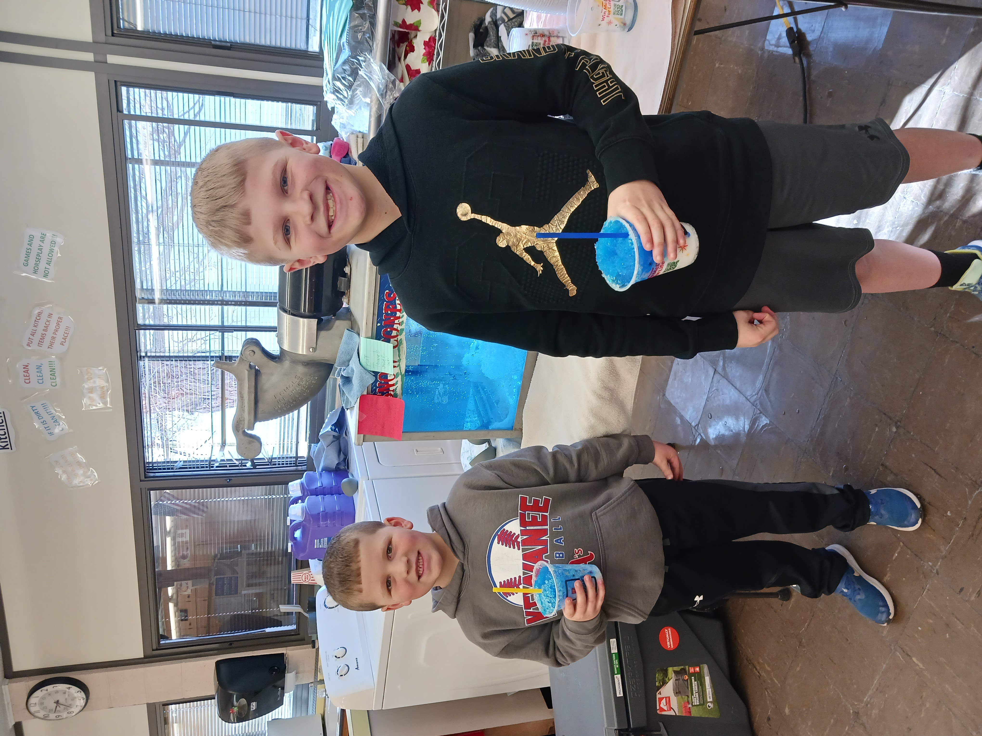 Pictures of Students helping and enjoying the Snow Cones Fundraiser