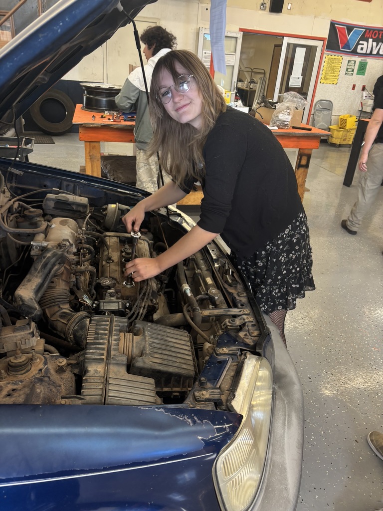 Girl working on a car