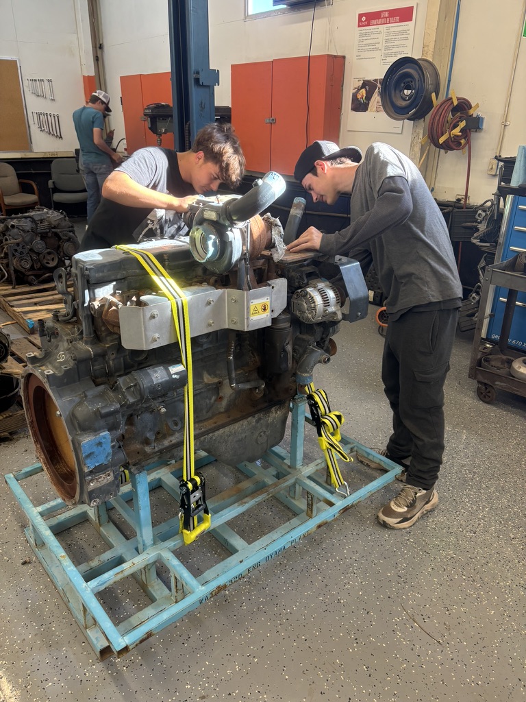 Boys looking at an engine