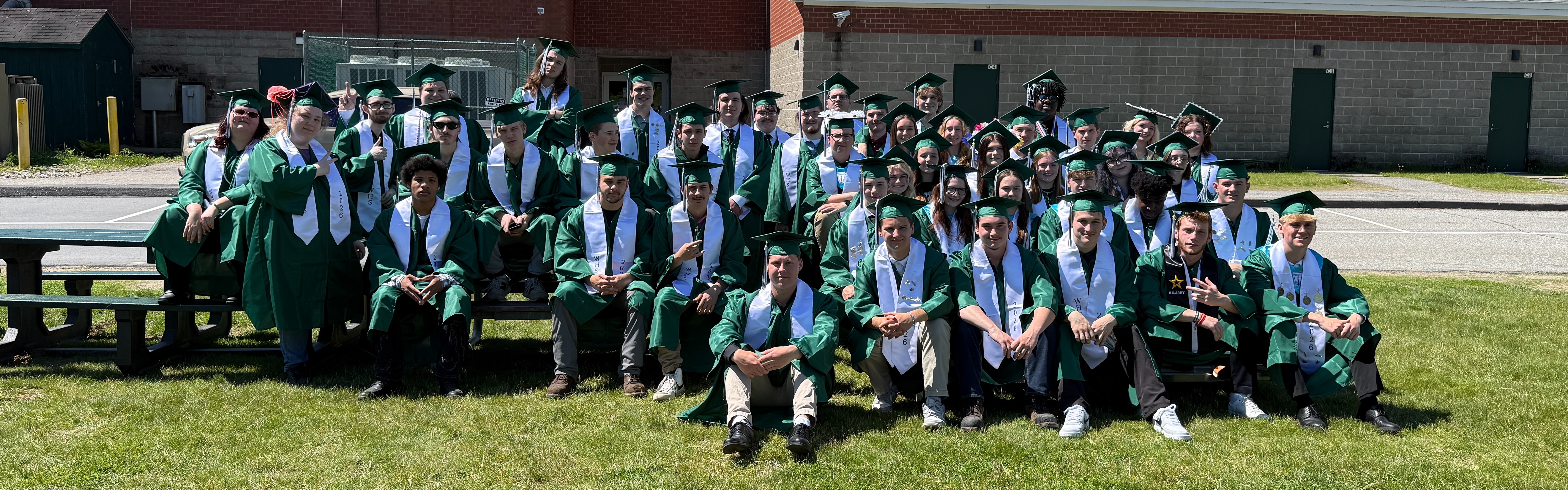 picture of students outside of a school- this is the graduating class of 2026
