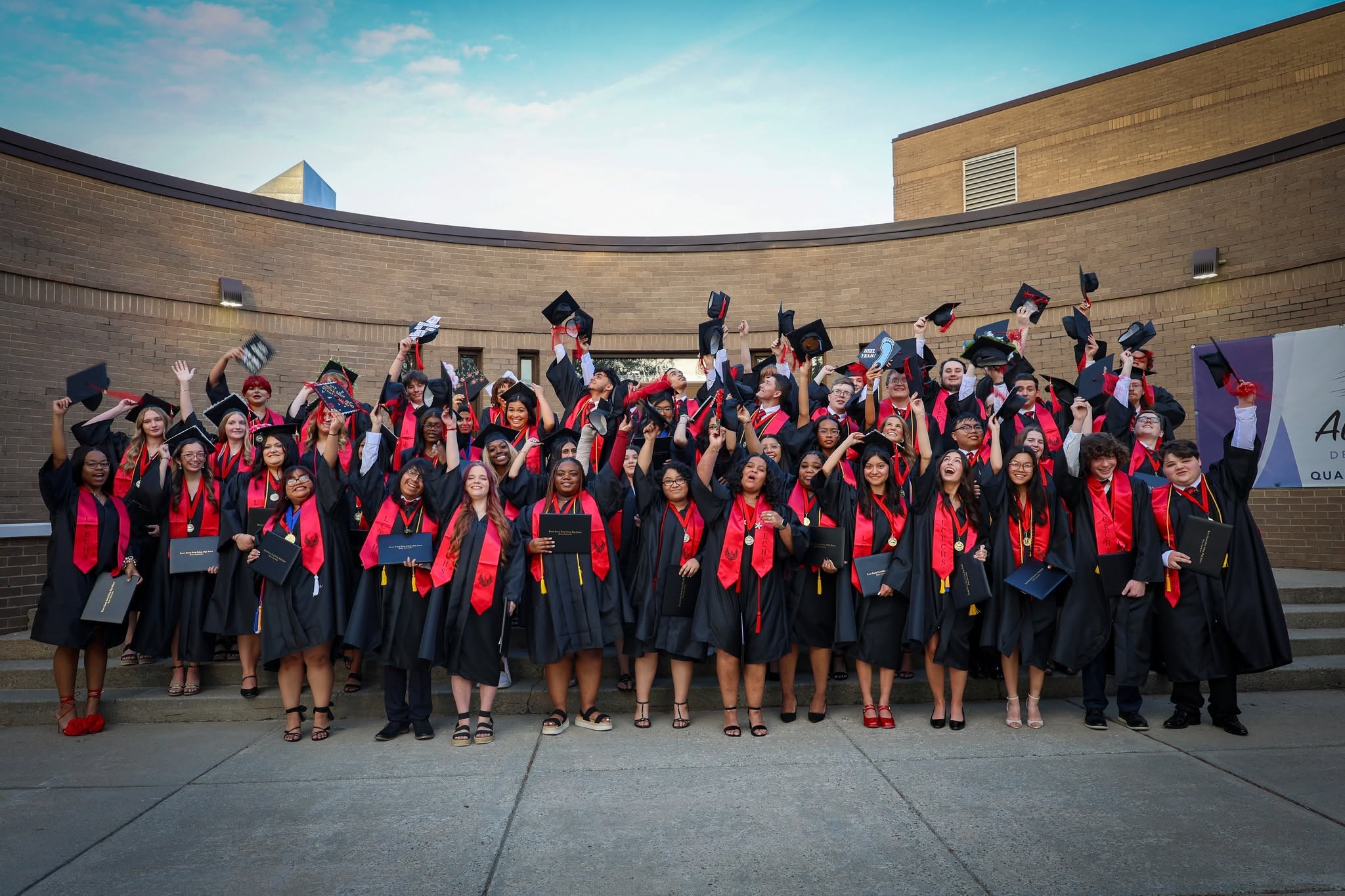 graduates throw their caps after graduation