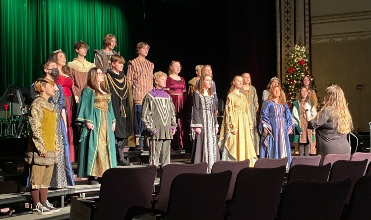 Photo of Madrigals singing on stage