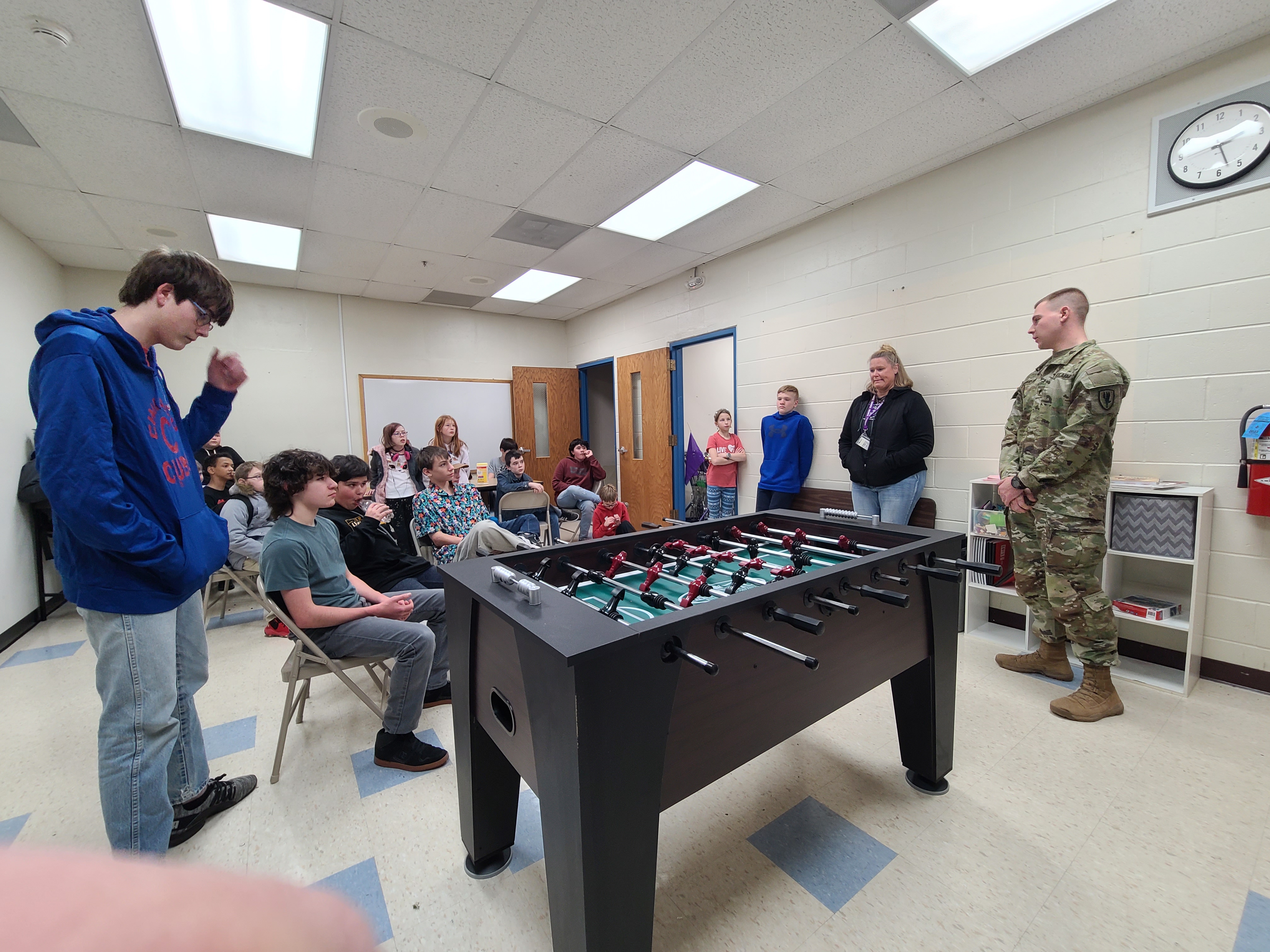 Photo of soldier speaking to students