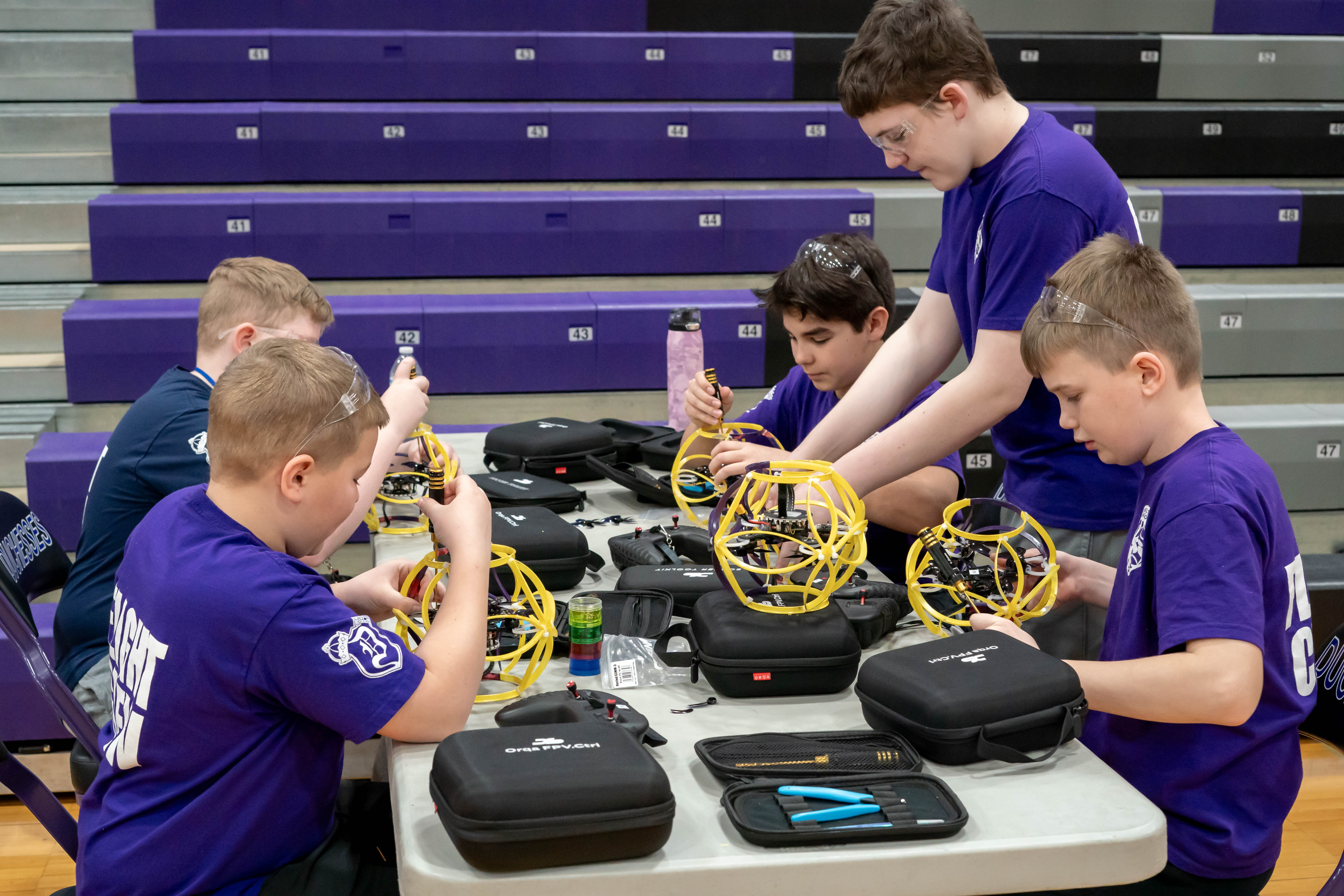 Photo of student and drones