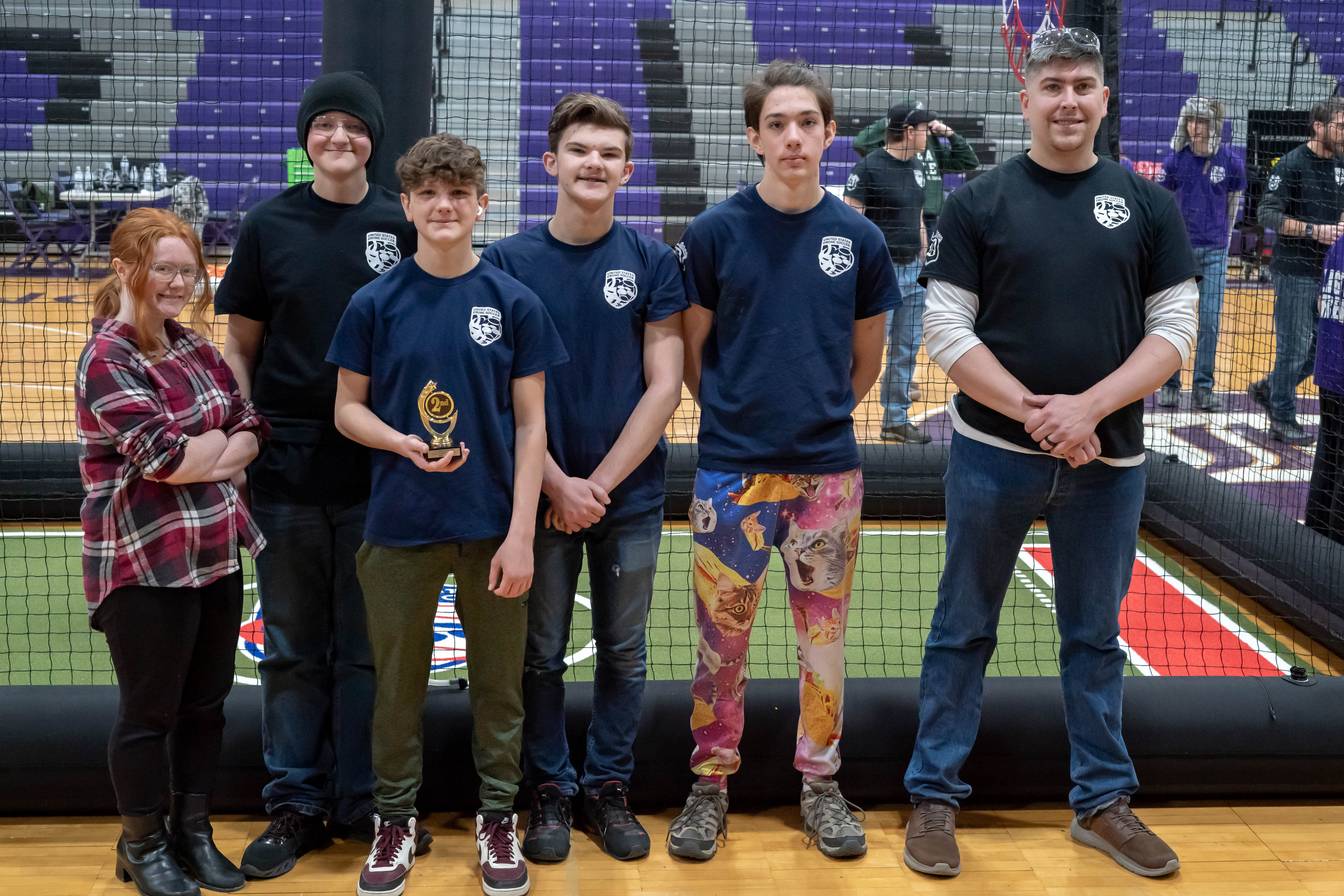 Photo of drone soccer team with trophy