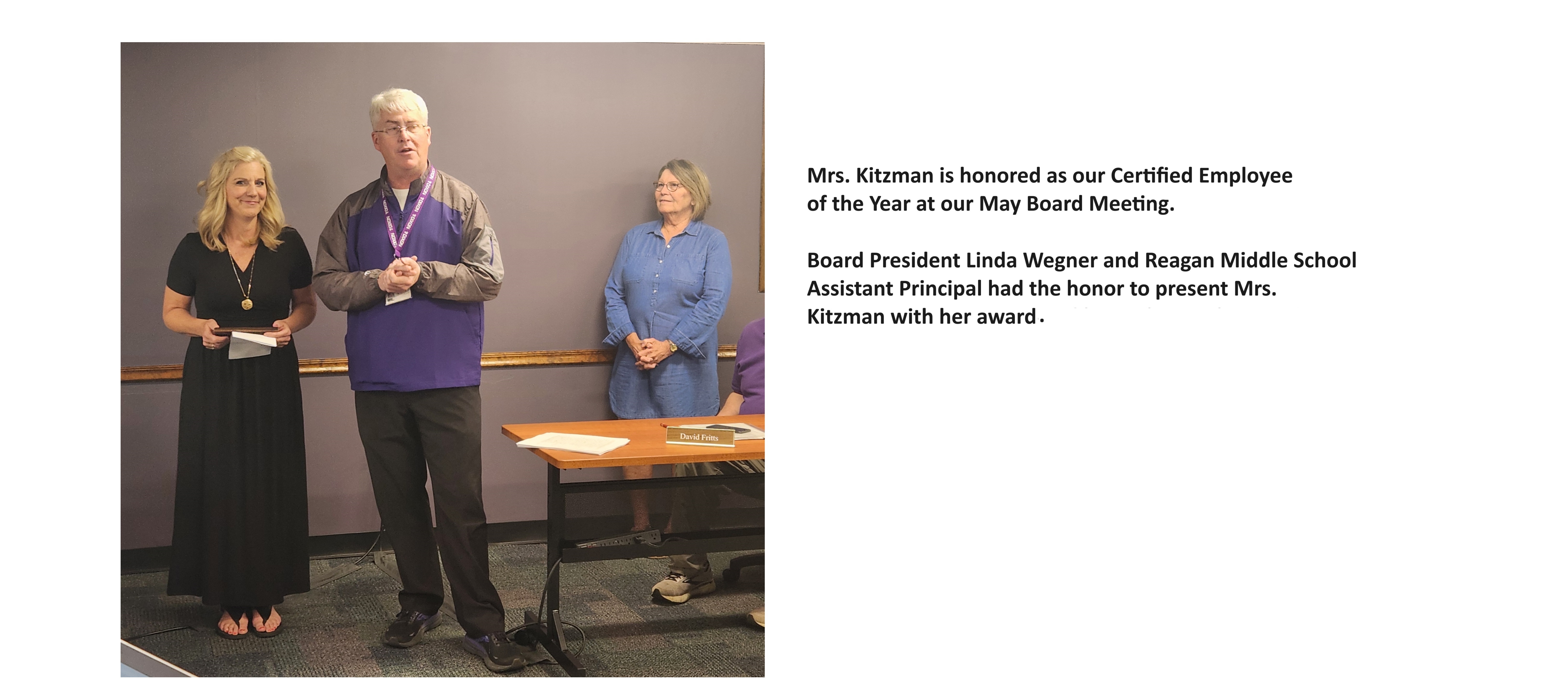Photo of Mrs. Kitzman getting her Employee of the Year award