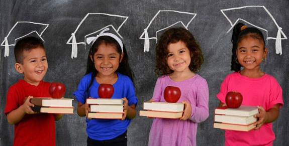 students holding books and apples