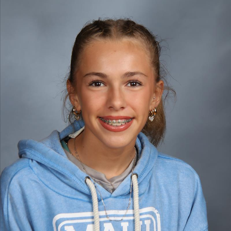 student of the month smiling for camera