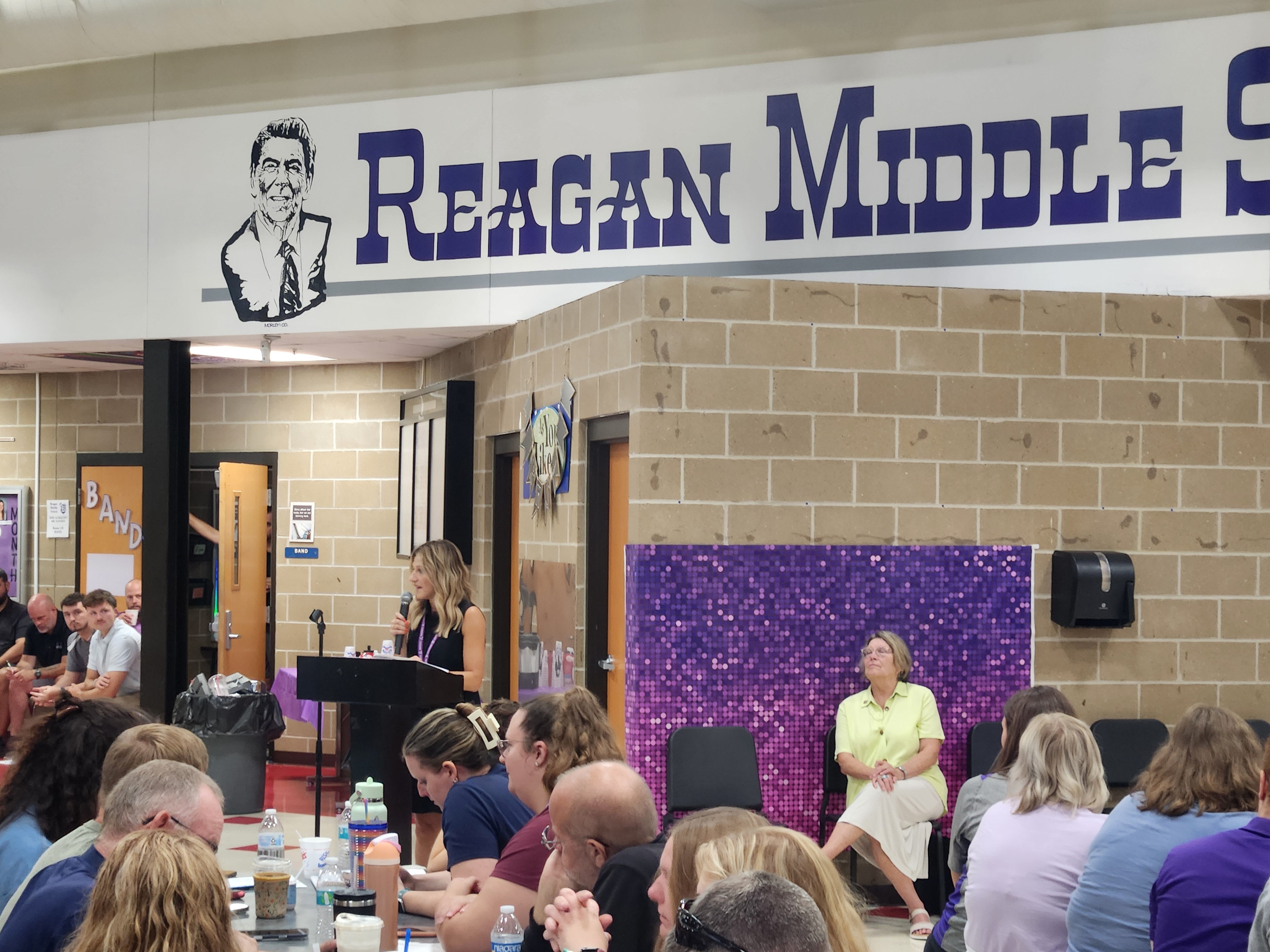 Superintendent addresses staff at the welcome breakfast