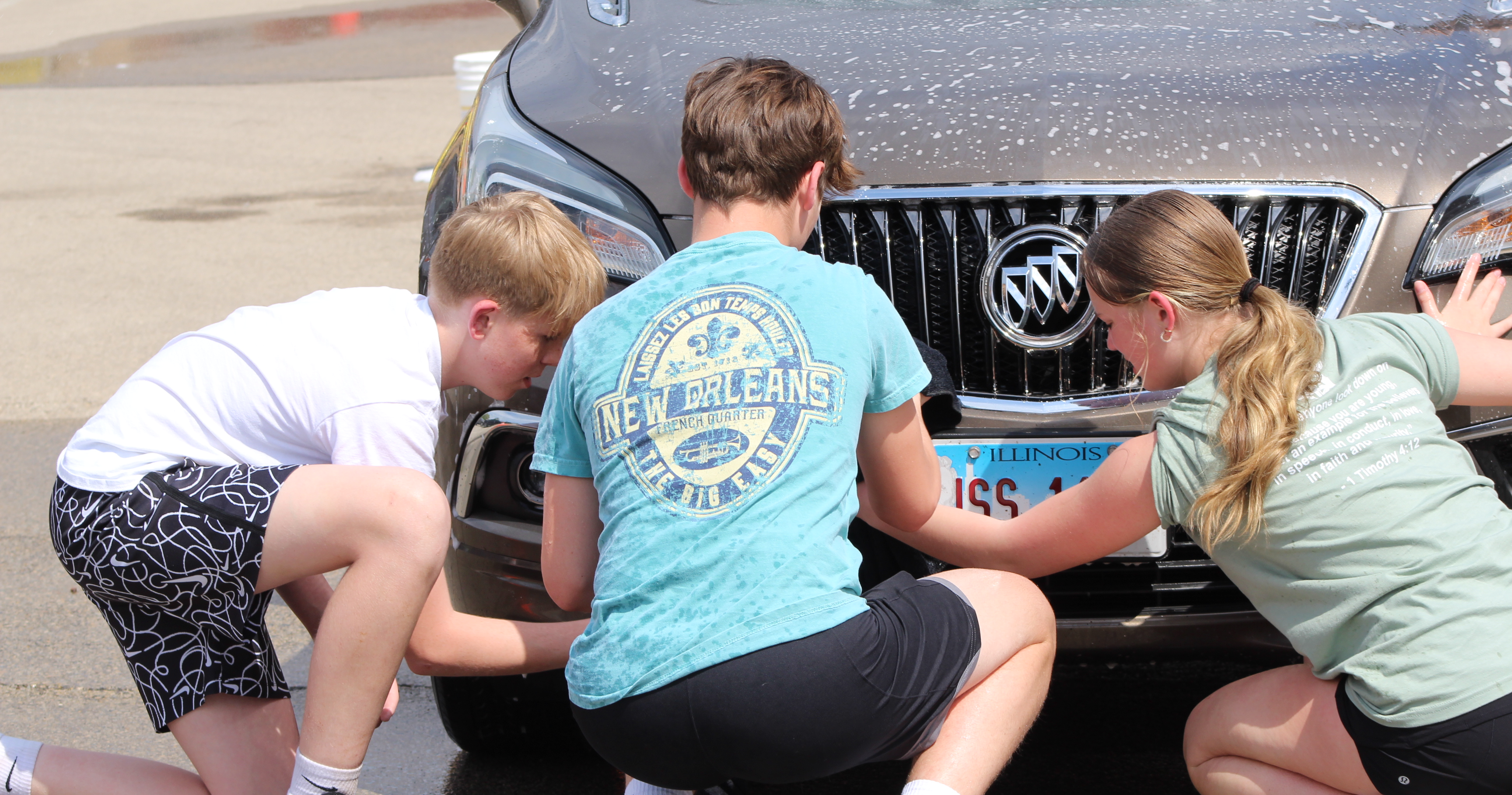 students washing the cars at FCA car wash