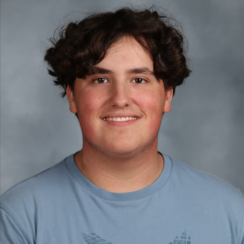 student of the month smiling for camera