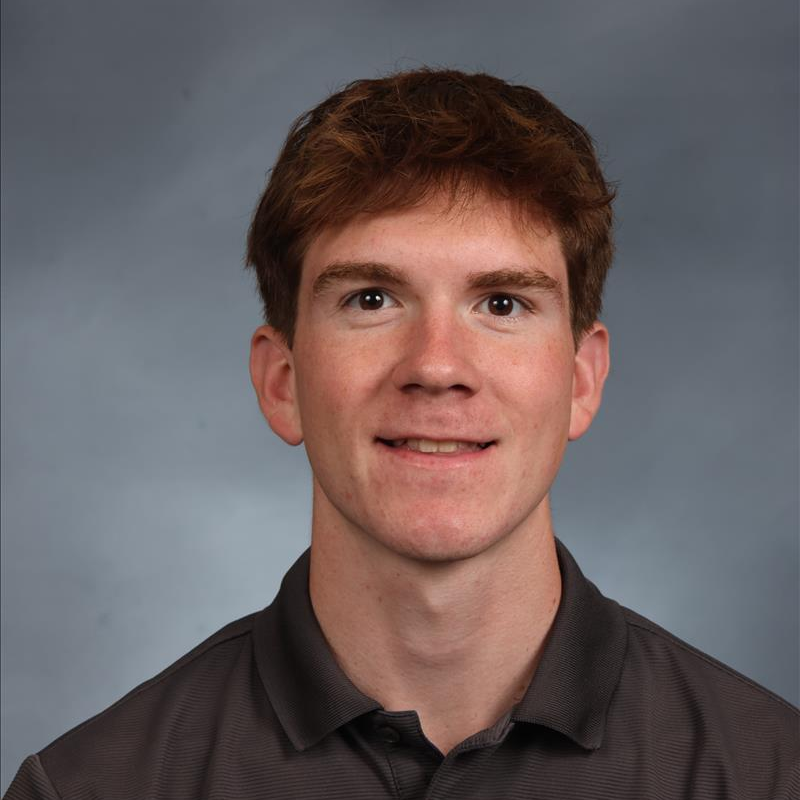 student of the month smiling for camera