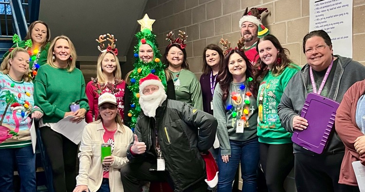 Reagan staff posing for photo in christmas attire