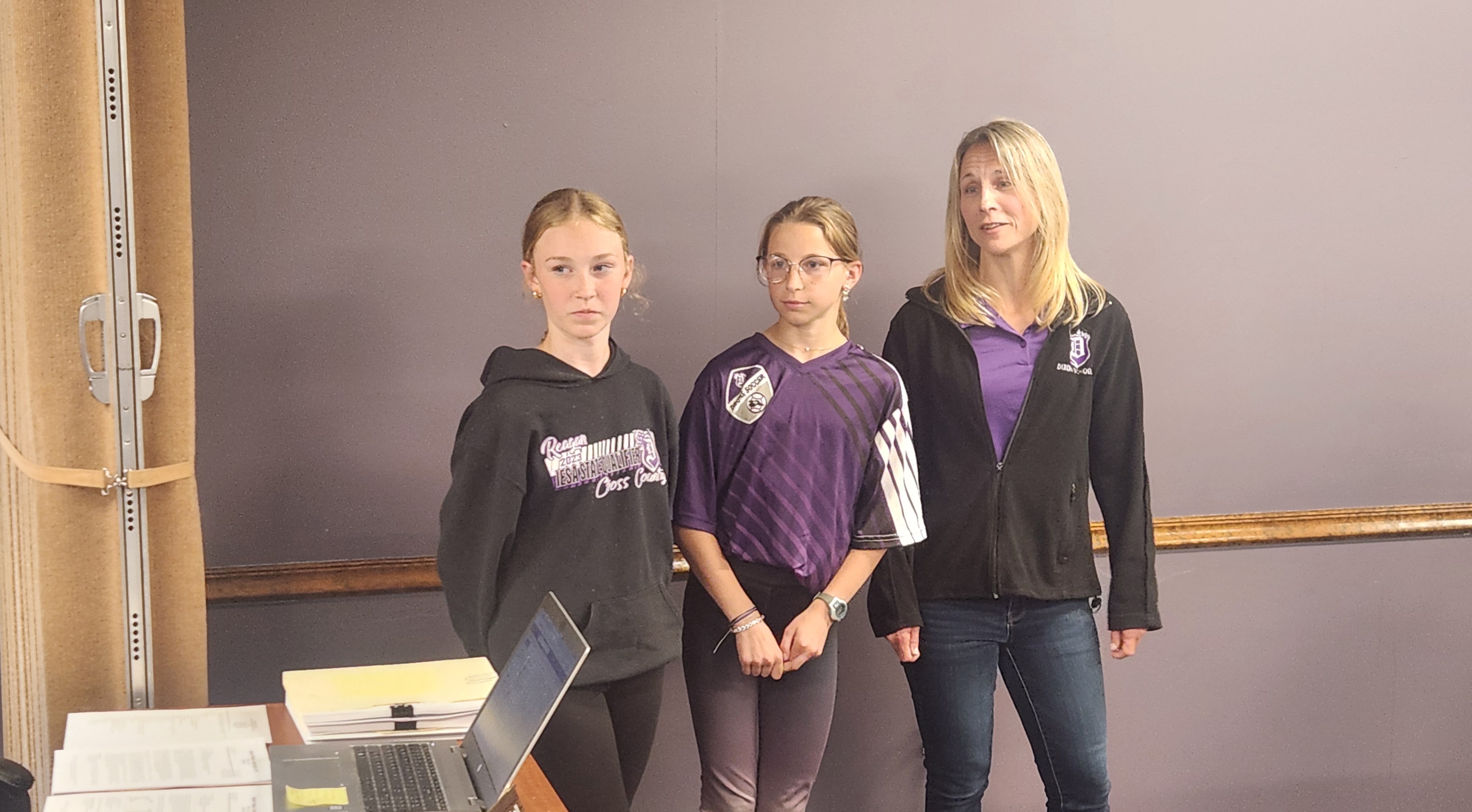 Mrs. Becker & 2 students talk to the board about builders club