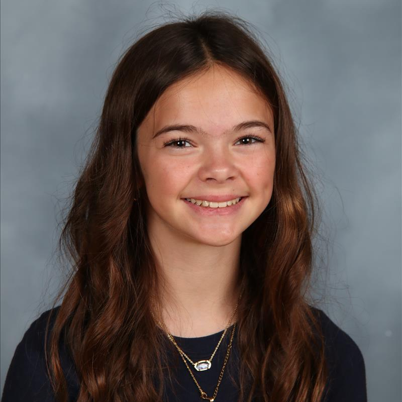 student of the month smiling for camera