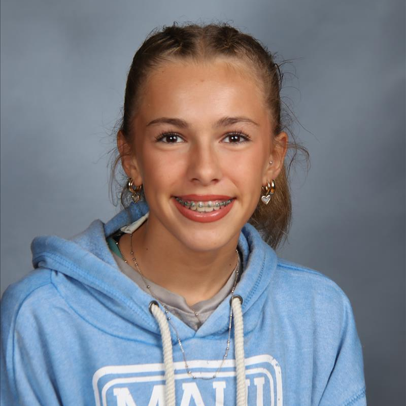 student of the month smiling for camera