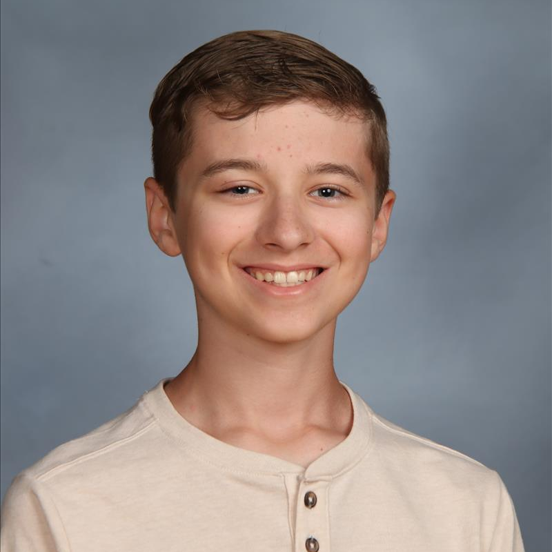 student of the month smiling for camera