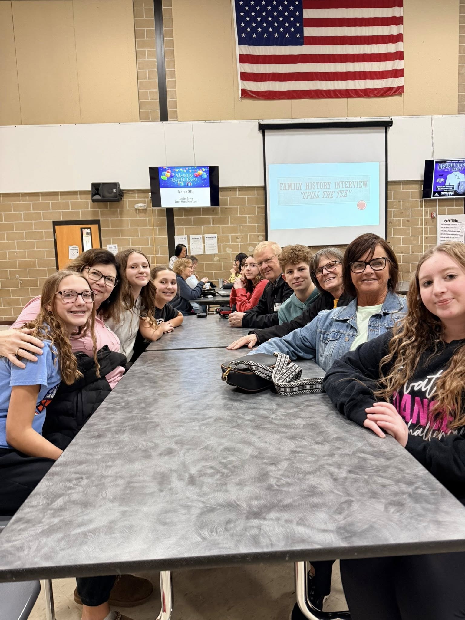 students and family at RMS night smiling for camera