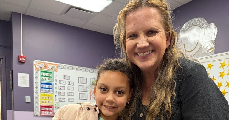 mrs thorpe with student smiling