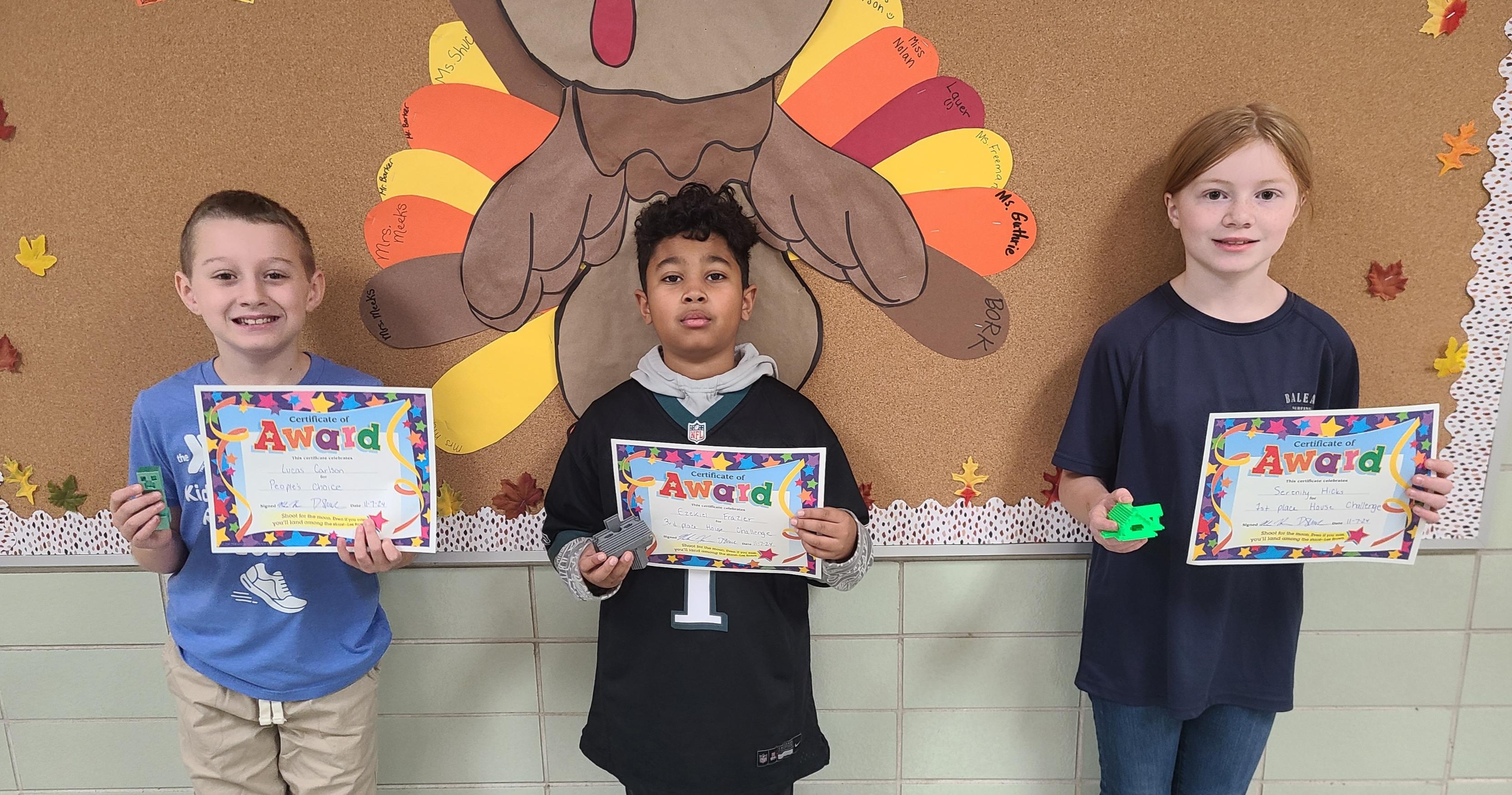 Madison students holding awards