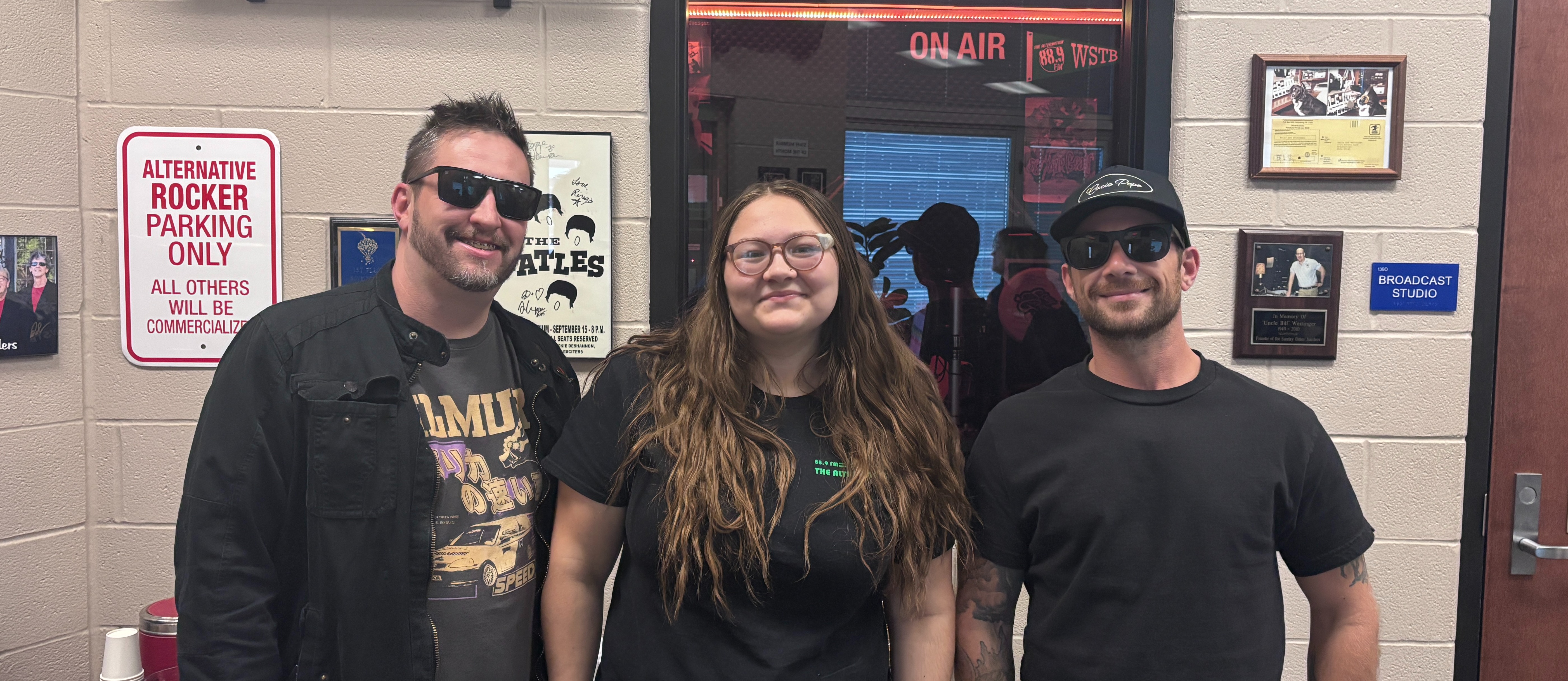 NEO band, How We Feel, posed in front of Studio A with Alice