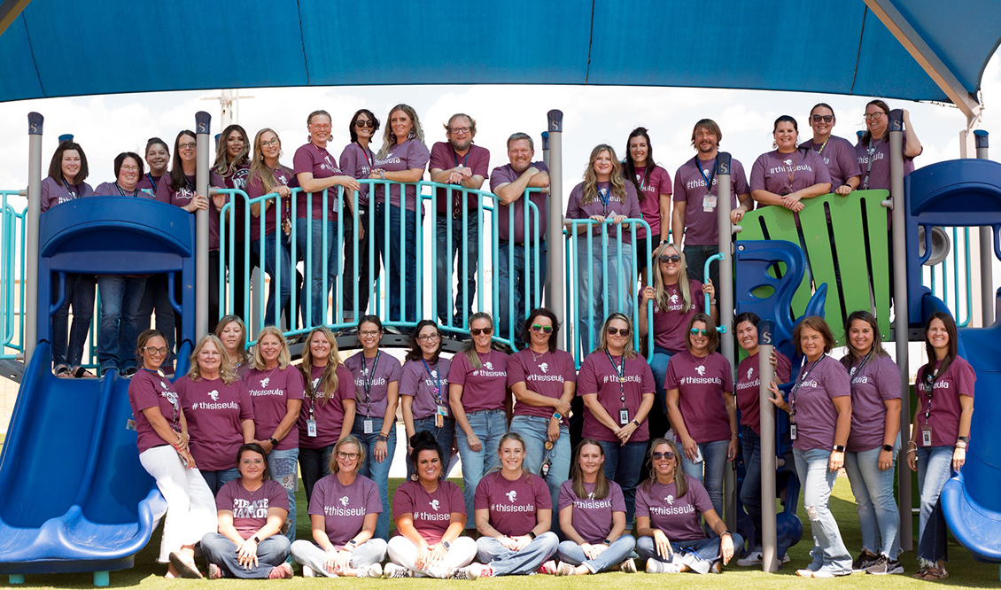 Elementary teachers show off the new playground equipment