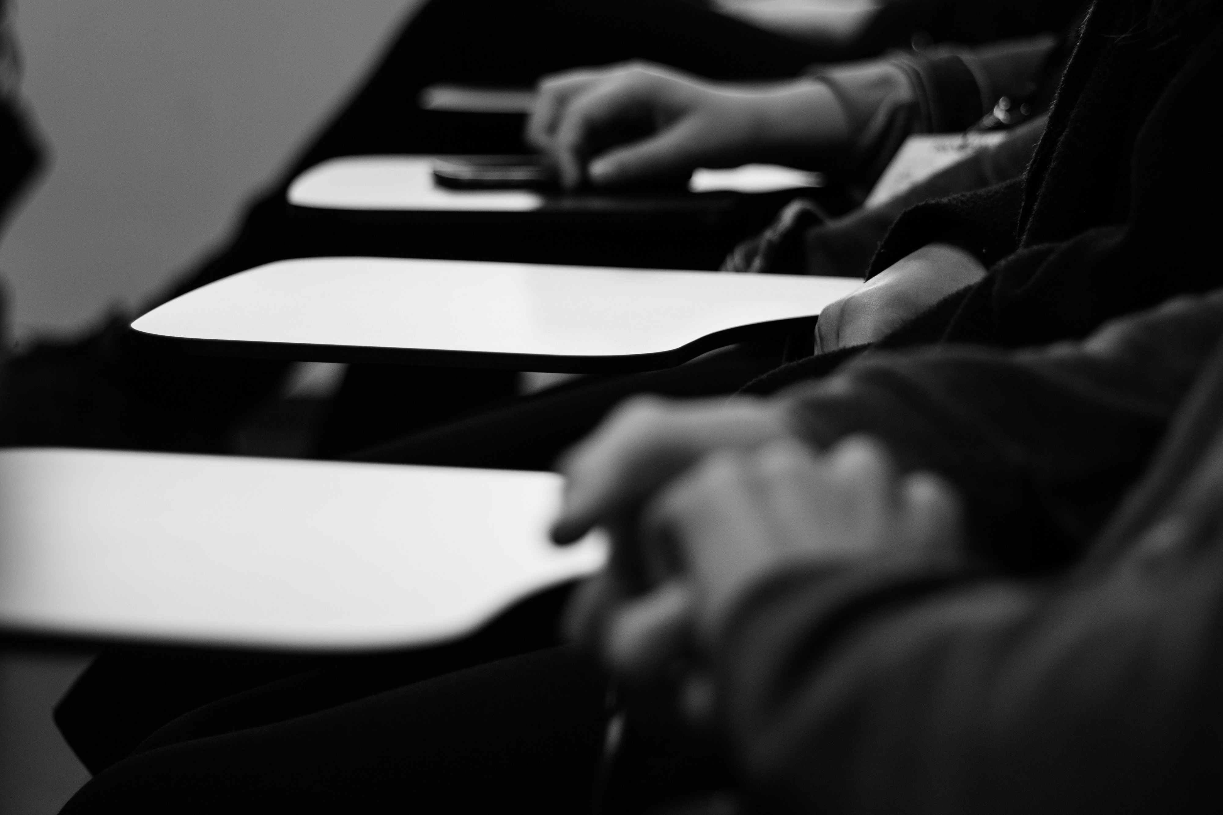 Image of hands on a desk at school