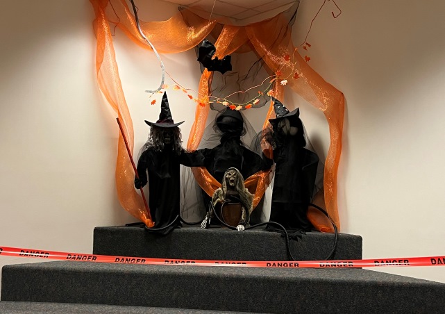 3 Witches on steps in Central's Library