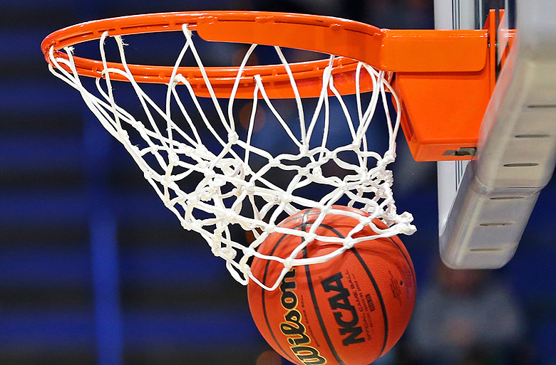 Basketball through hoop.