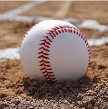 Baseball sitting on dirt