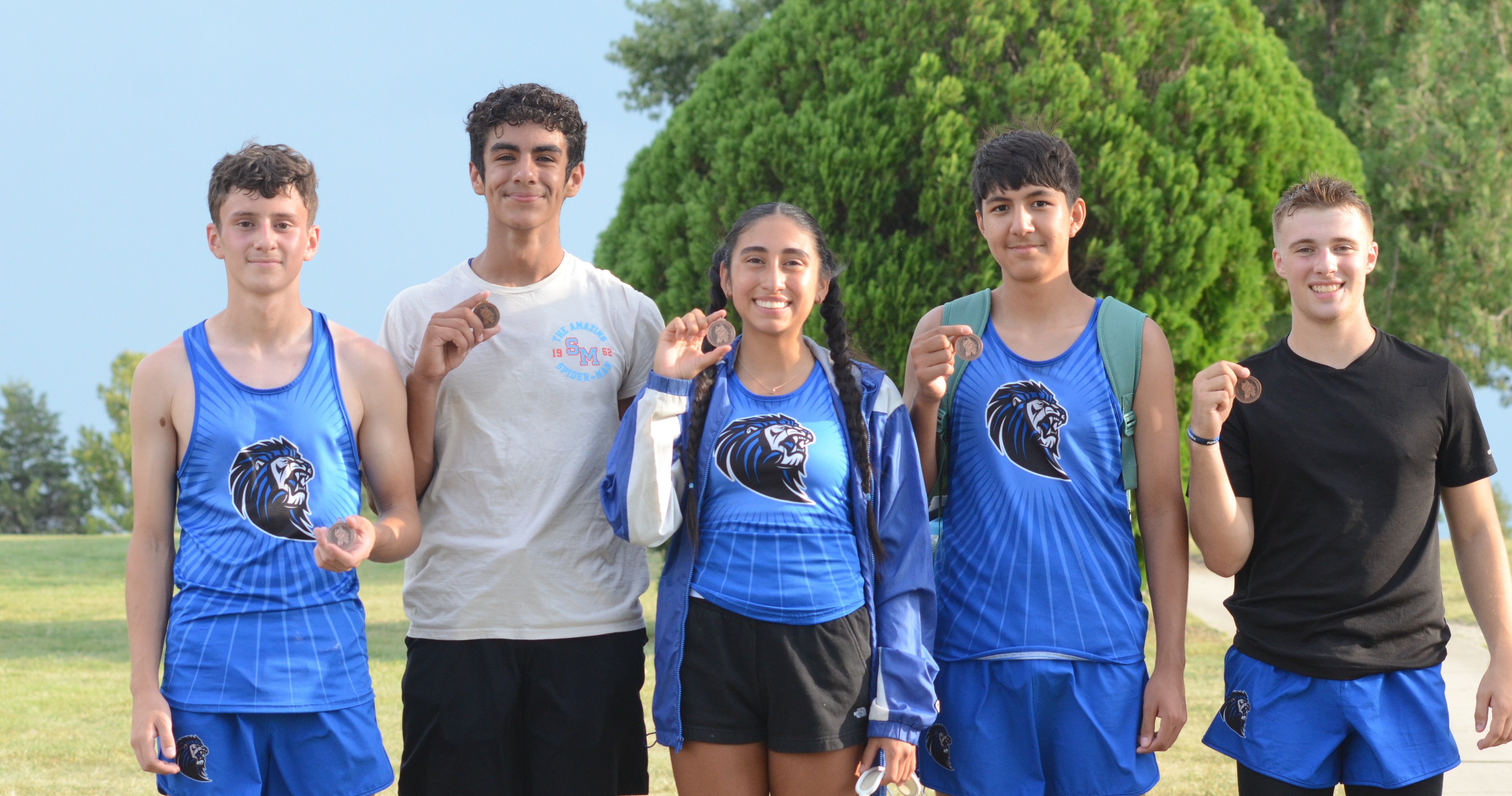 Cross Country Students Holding Their Medals.