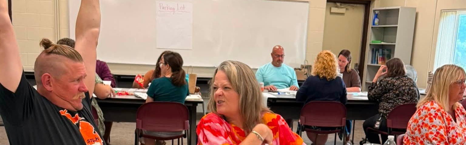Staff working on data at tables