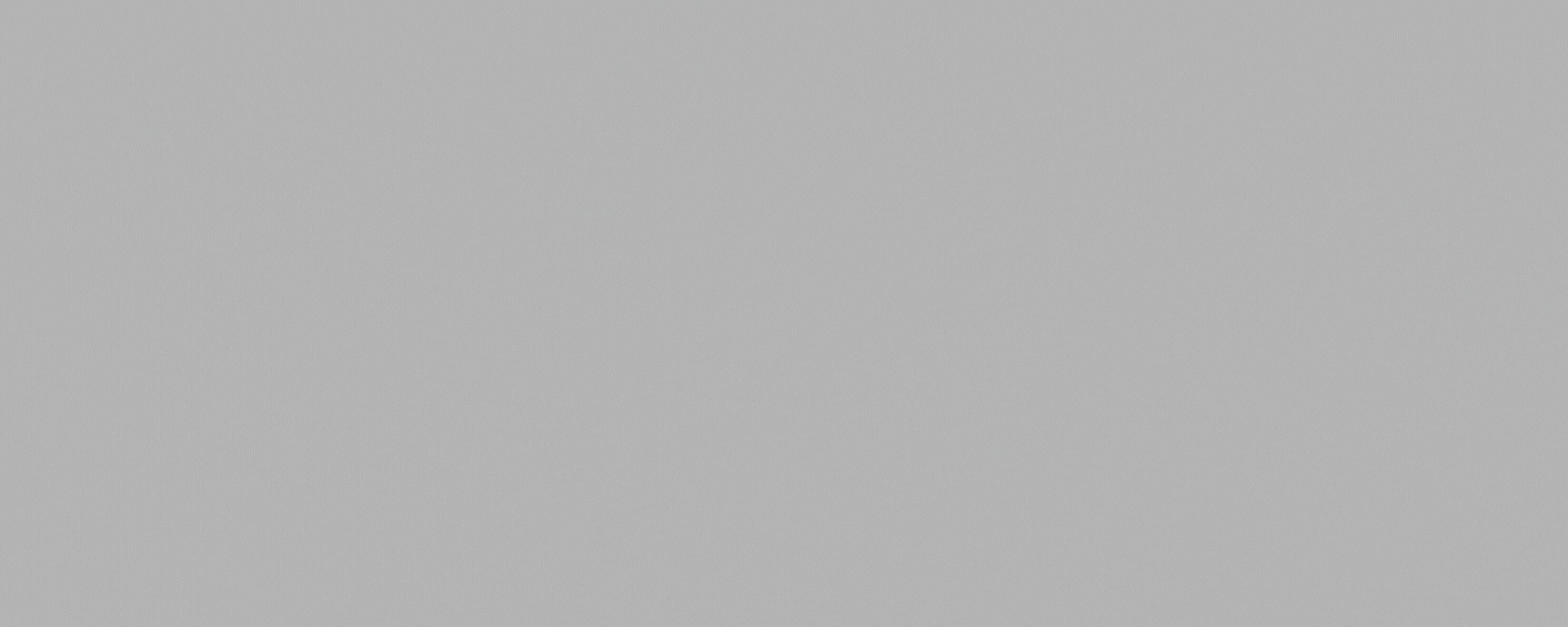 A white background displays a blurry, indistinct, and faint image of what appears to be a person's face.