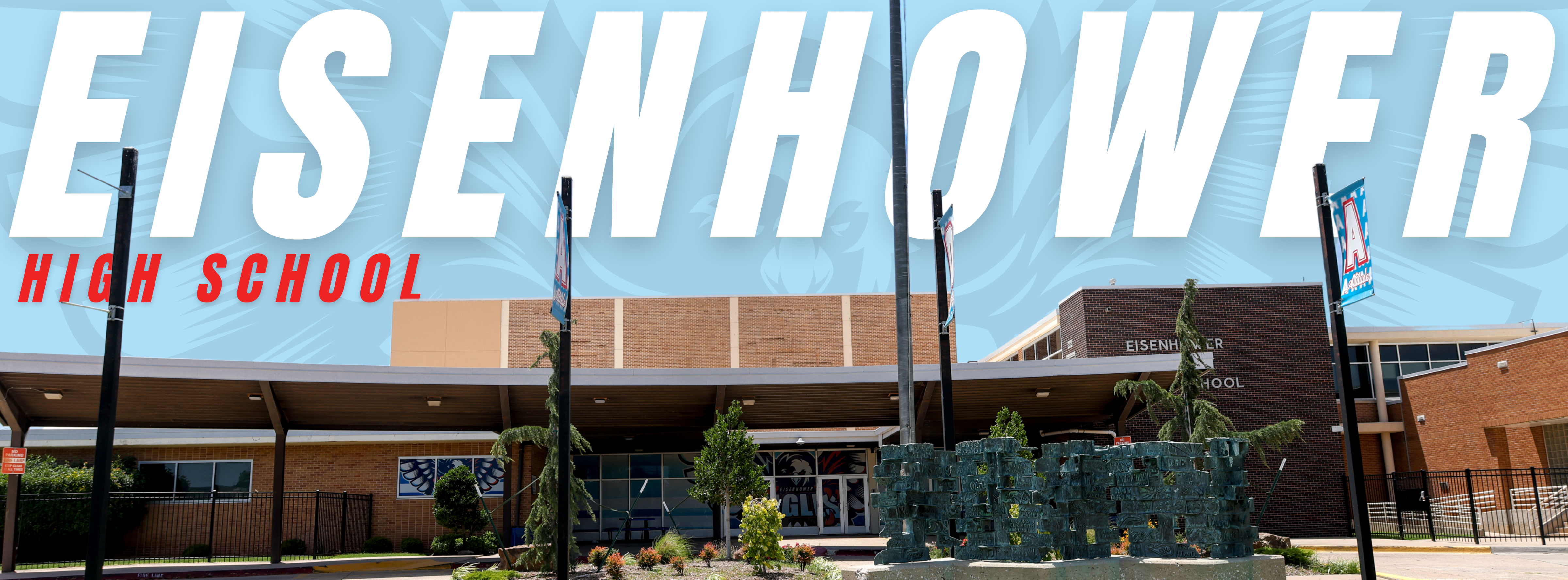 A school building with a sign reading "Eisenhower High School". Flags on poles are present in the foreground.