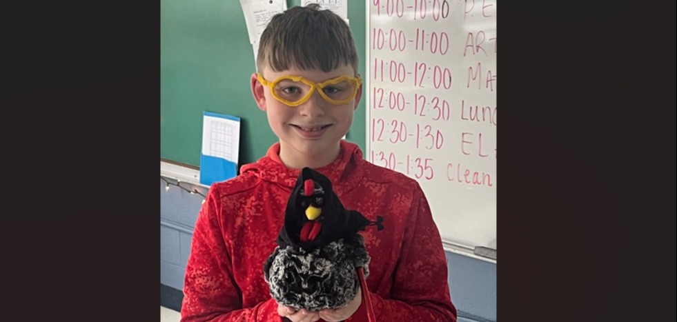 Student with chicken stuffed animal