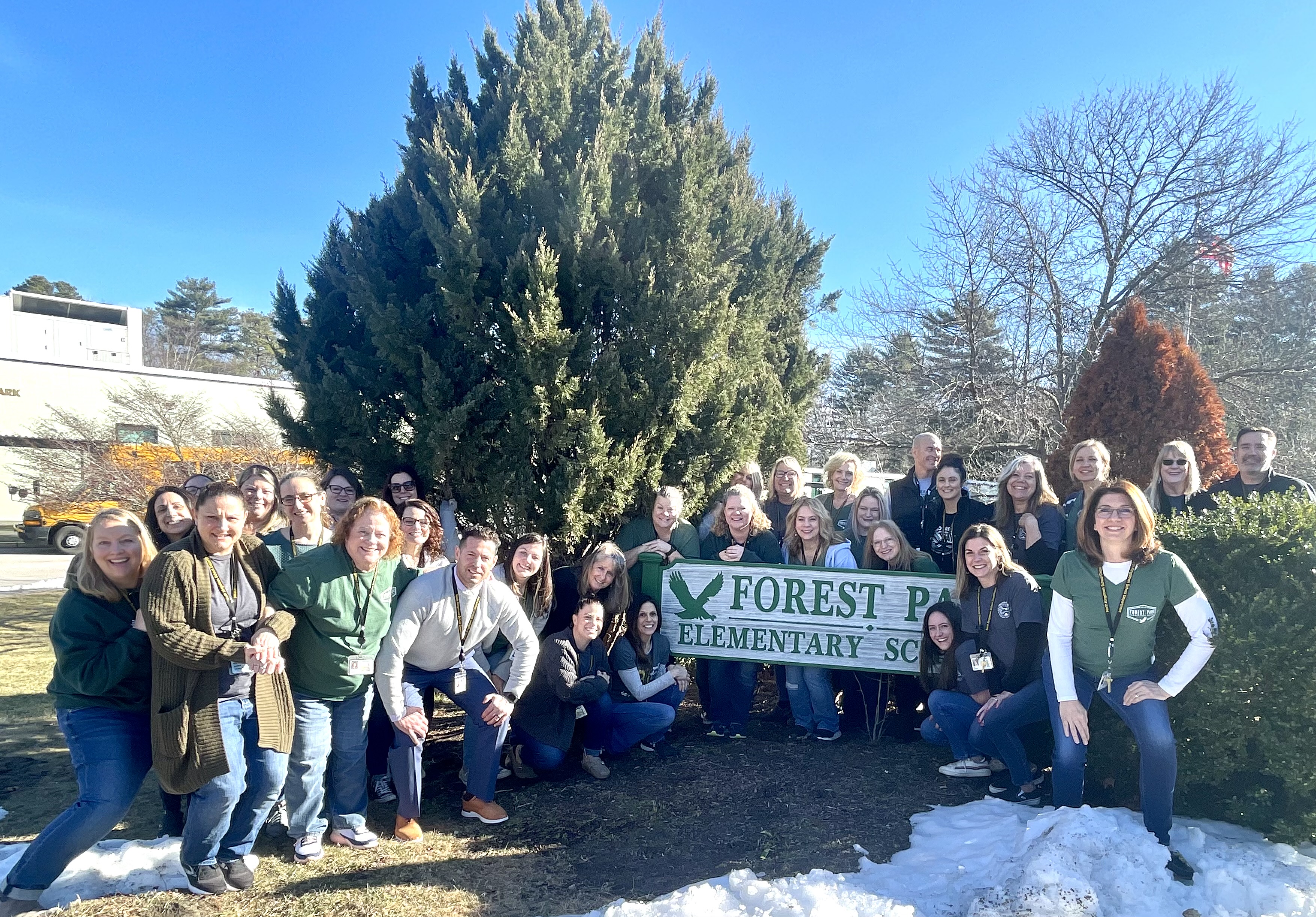 Students surrounding Forest Park Elementary sign