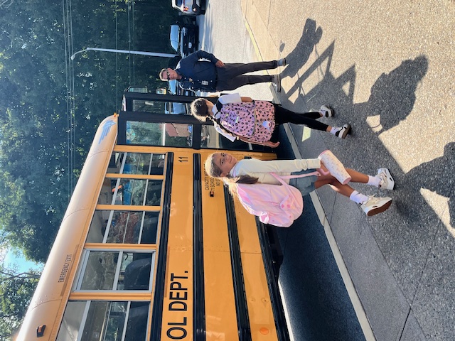 Dr. Duva helping on Buses! 