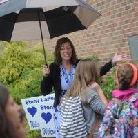 Principal Greeting Students