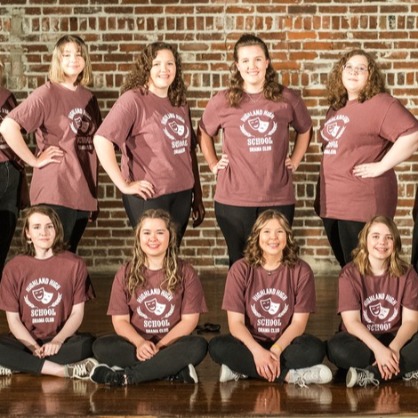 Drama club poses on stage