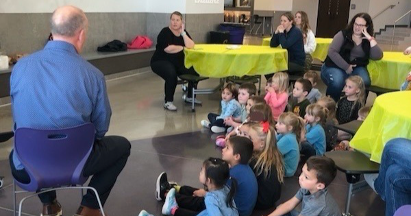 Superintendent reading to preschoolers