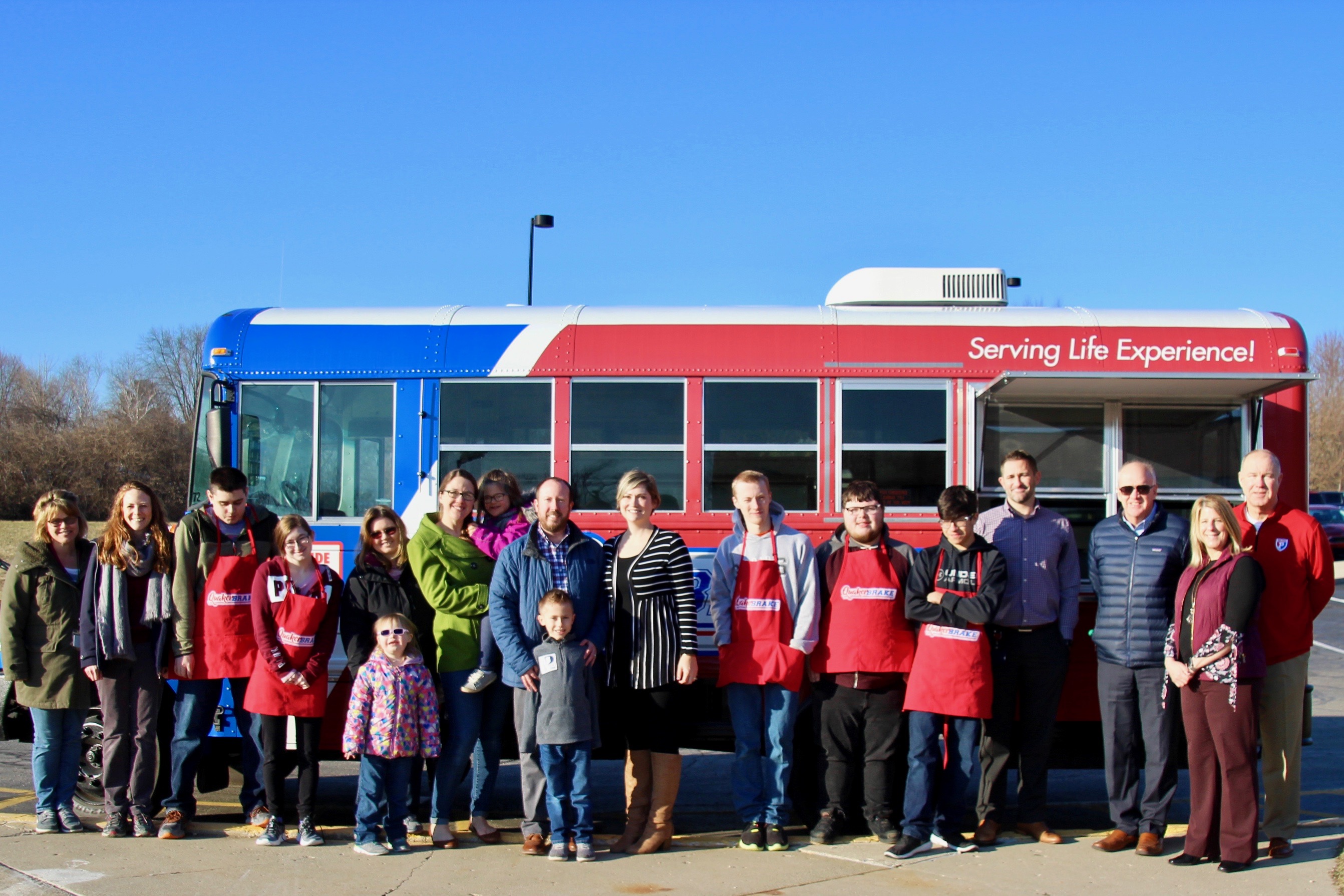 photo of parents and students in front of a food truck
