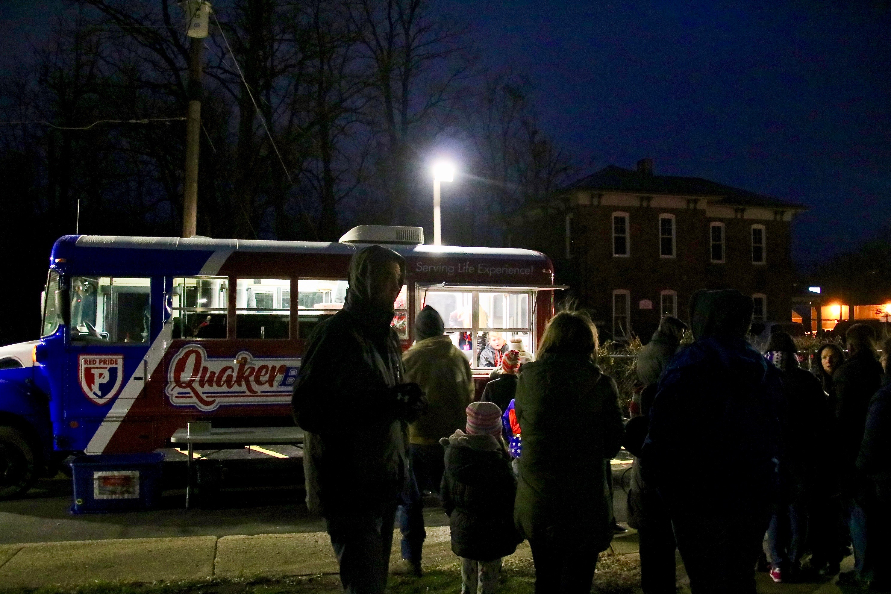 photo of people standing in line at a food truck