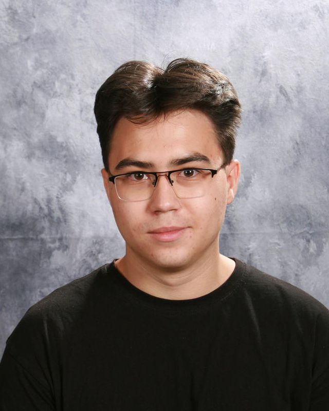 teenage boy with glasses and brown hair