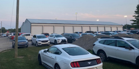 Cars parked on campus - not in legal parking spots and in grass