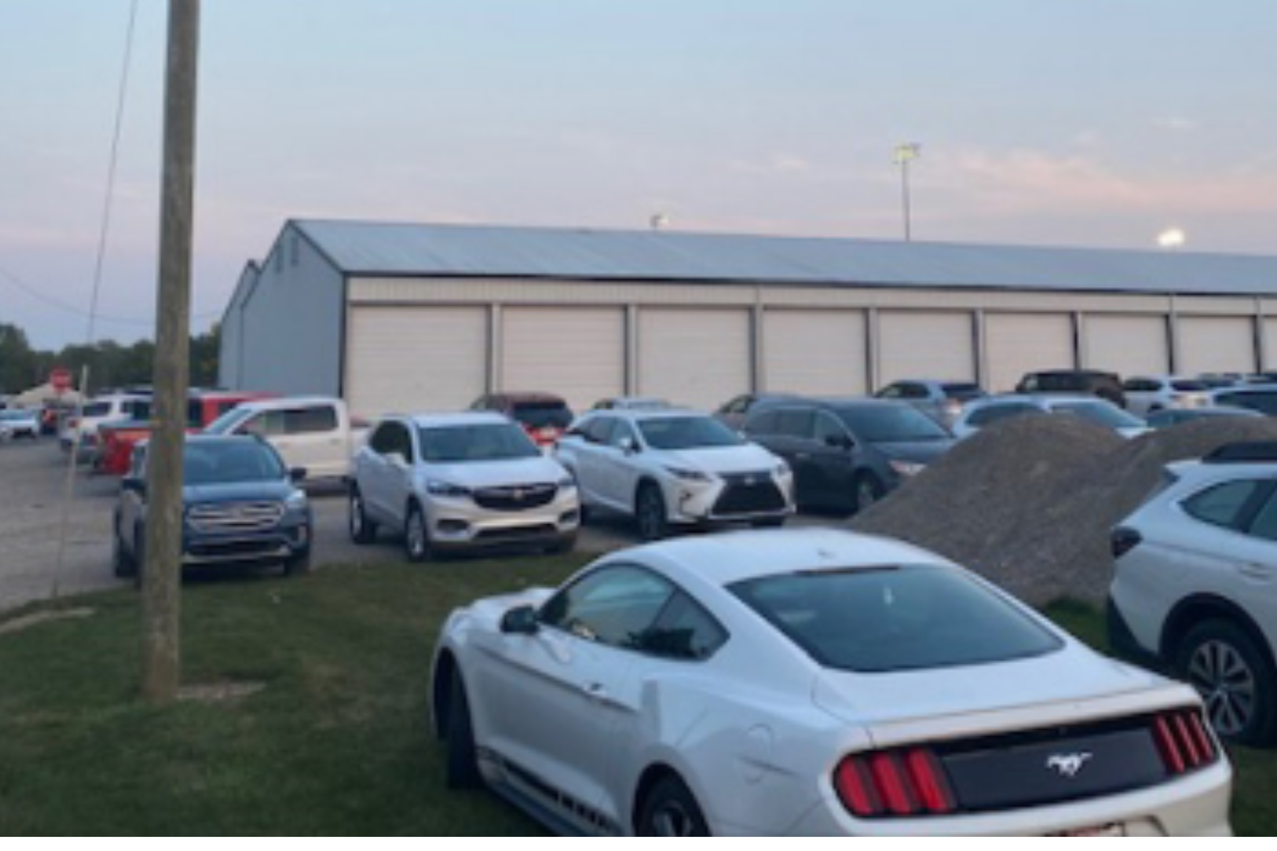 Cars parked at high school football game