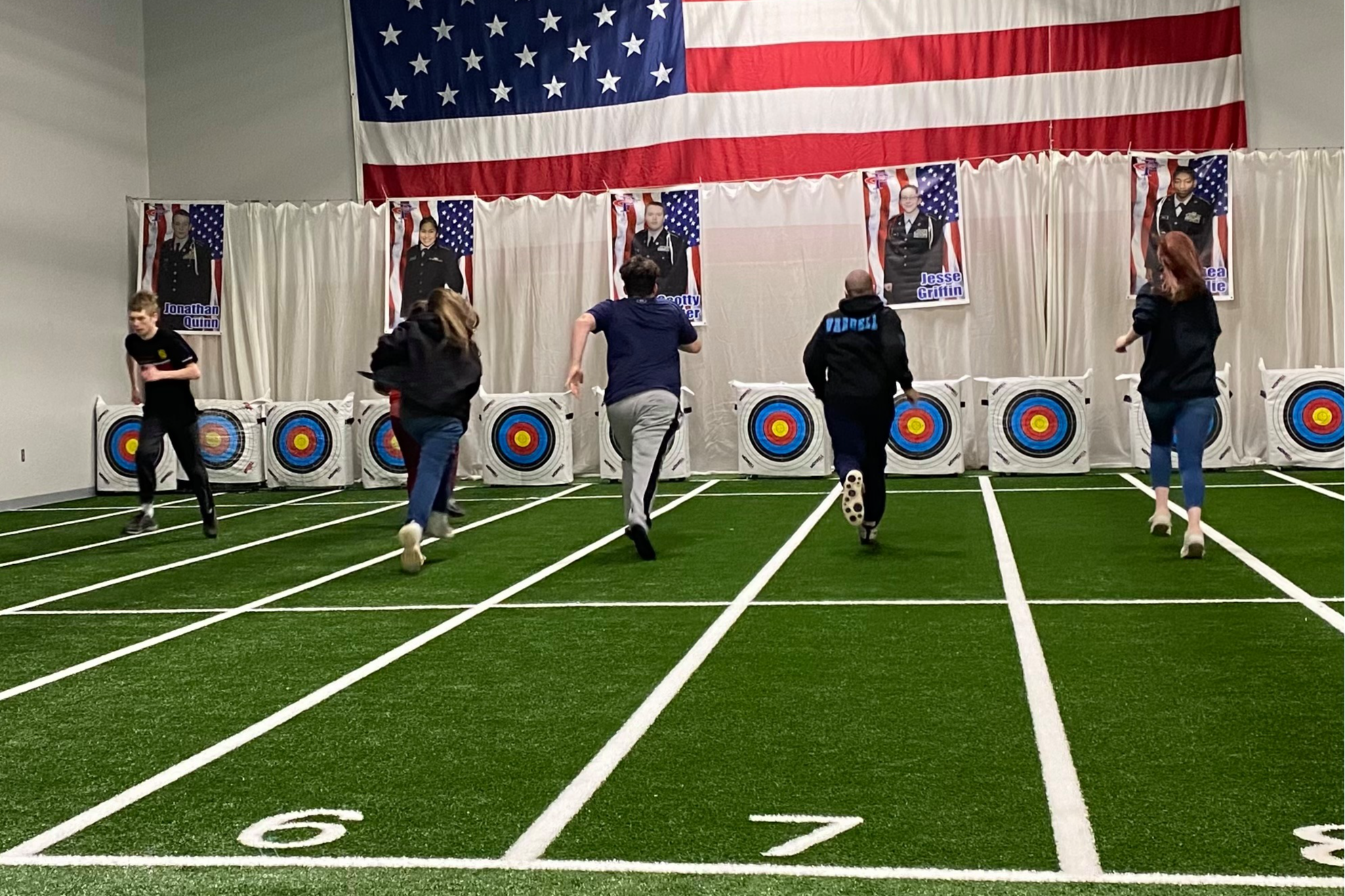 Students running in JROTC's new indoor training facilities